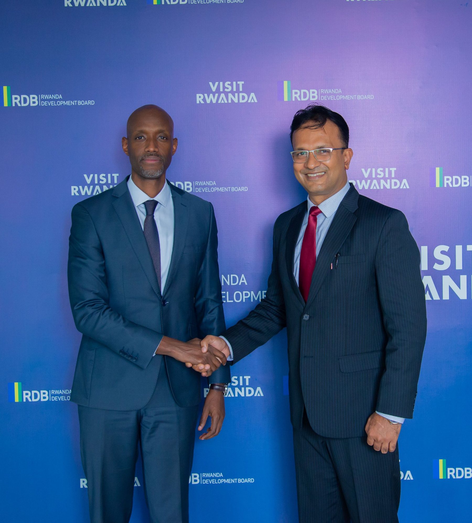 High Commissioner shaking hands with Mr. Jean-Guy K. Afrika, CEO of the Rwanda Development Board